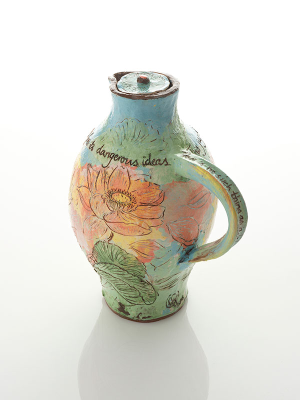 Small decorated jug and cover