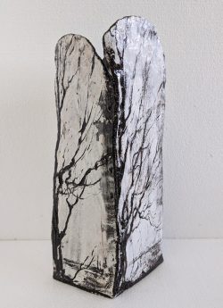 White square vase with black trees drawn on it